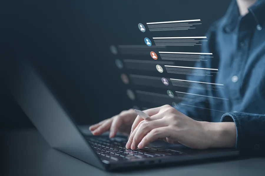 Customer records and contact profiles floating over a laptop